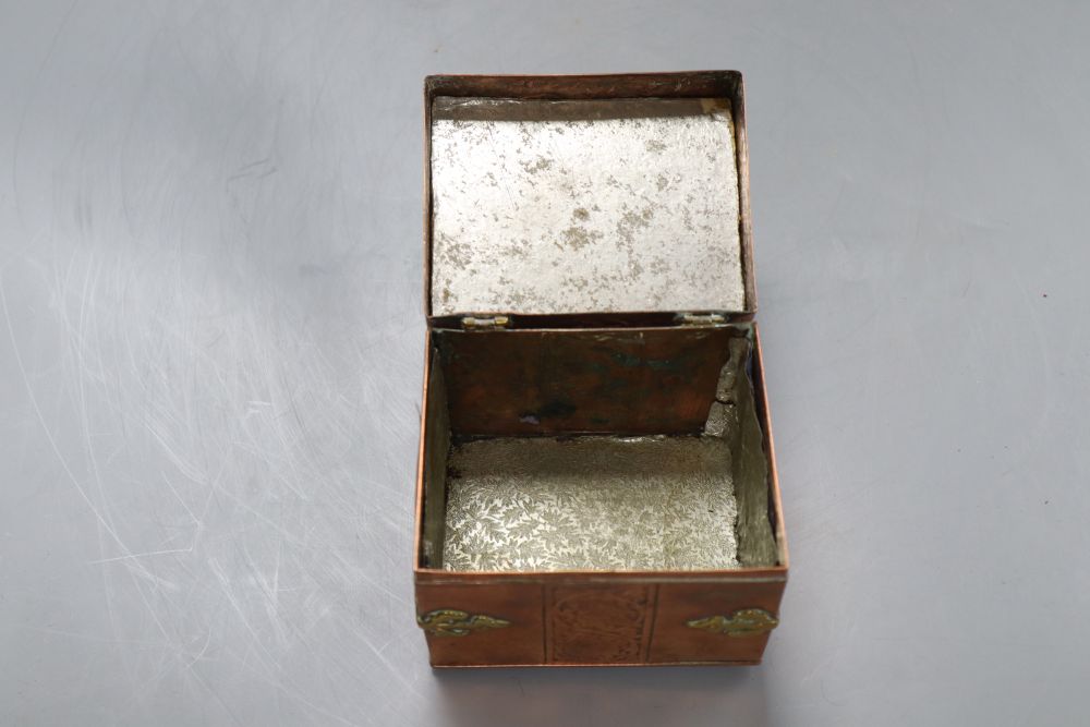 A copper brass mounted miniature casket, width 10cm height 9cm